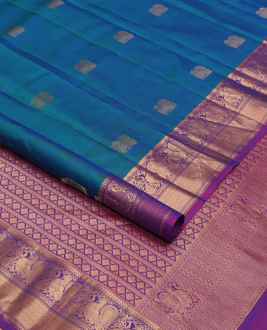 Blue mayil buttas zari woven silksaree, contrast border of mayil & mayil kann designs & diamond-patterned pallu
