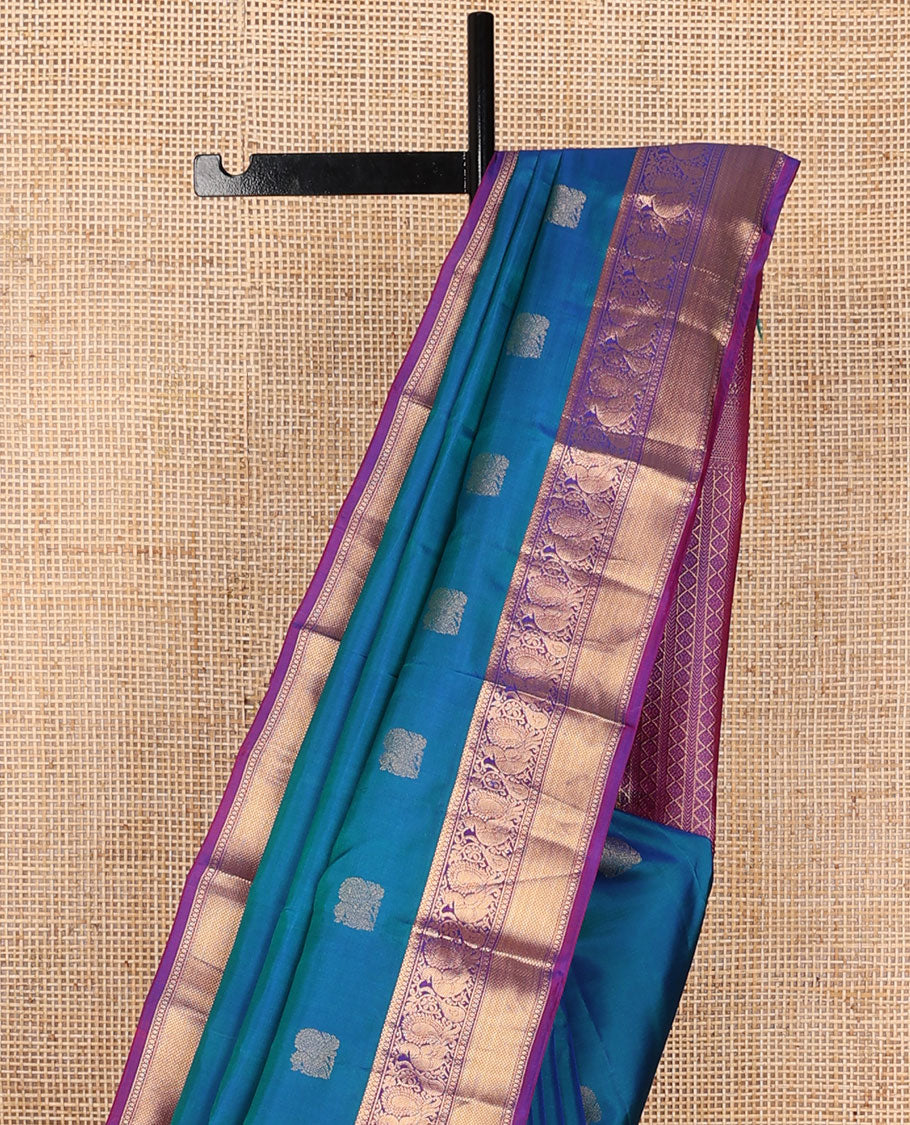 Blue mayil buttas zari woven silksaree, contrast border of mayil & mayil kann designs & diamond-patterned pallu