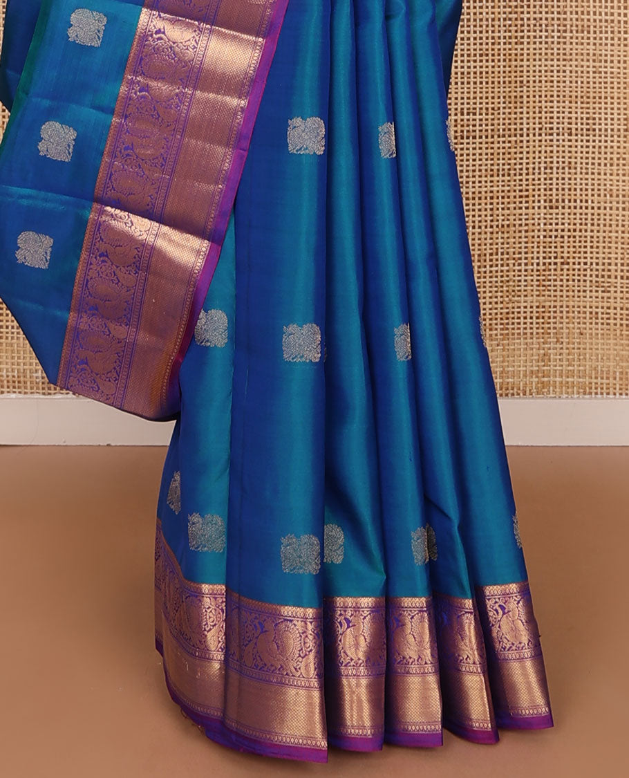 Blue mayil buttas zari woven silksaree, contrast border of mayil & mayil kann designs & diamond-patterned pallu