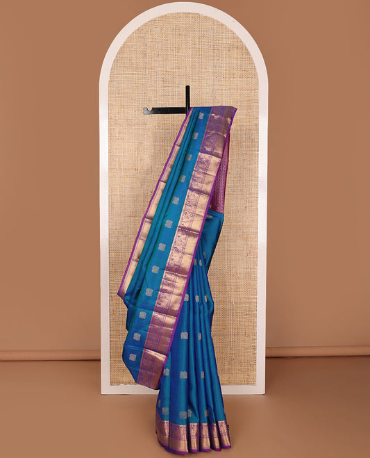 Blue mayil buttas zari woven silksaree, contrast border of mayil & mayil kann designs & diamond-patterned pallu