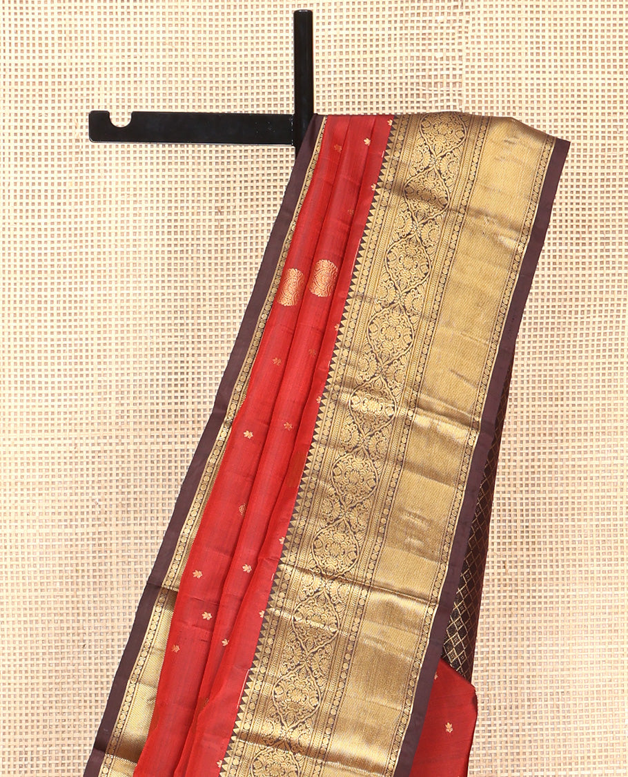 Maroon Vasundhara Silk Saree, Decked Up with Zari Buttas All Over Its Body, Complemented by Contrast Border of Rekku Poun, Muthu, and Floral Designs, Grand Jaal Pallu and Paired with a Contrast Blouse