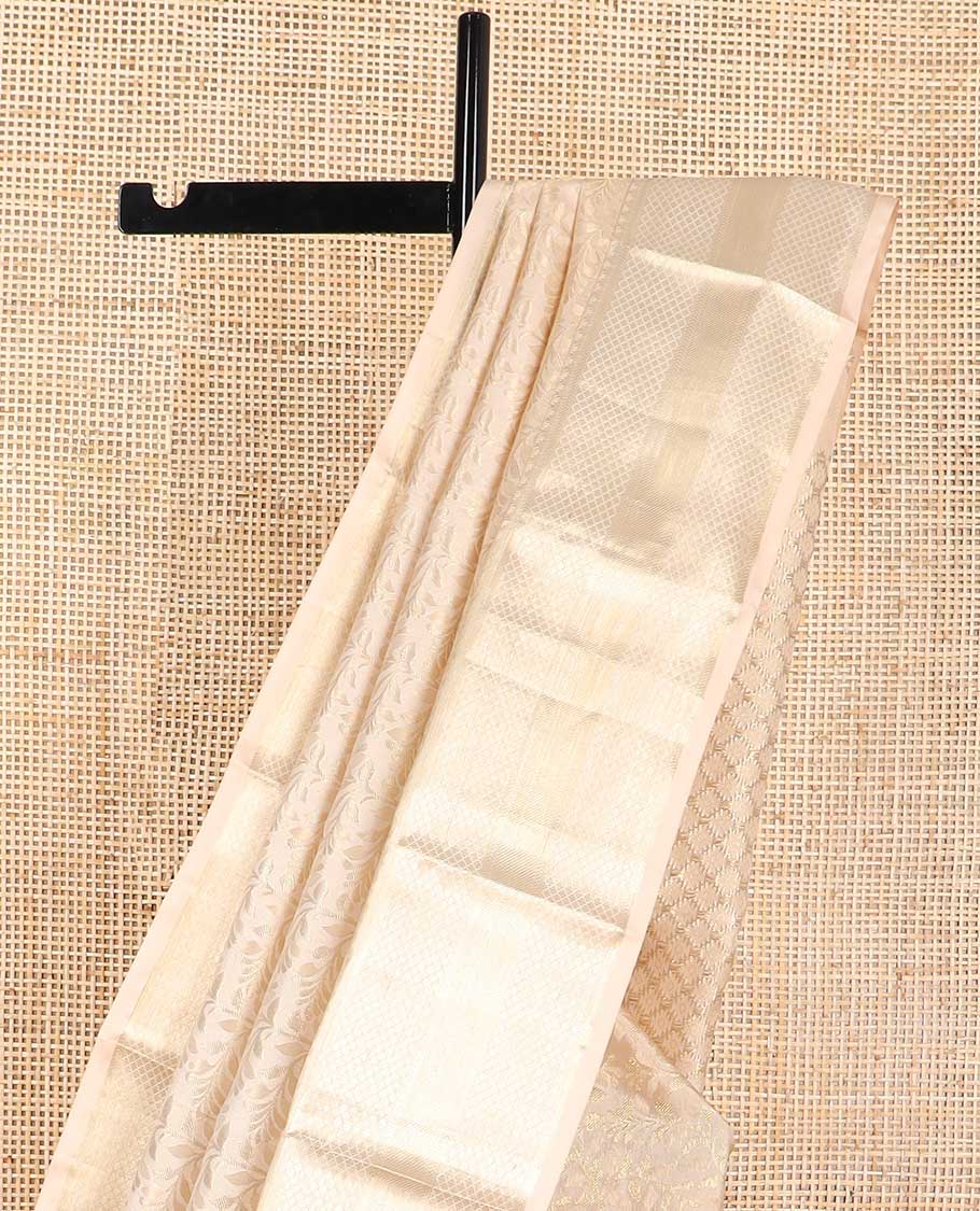 Cream floral vine design kancheepuram silk saree with self border of banaras, checked design border & floral design pallu