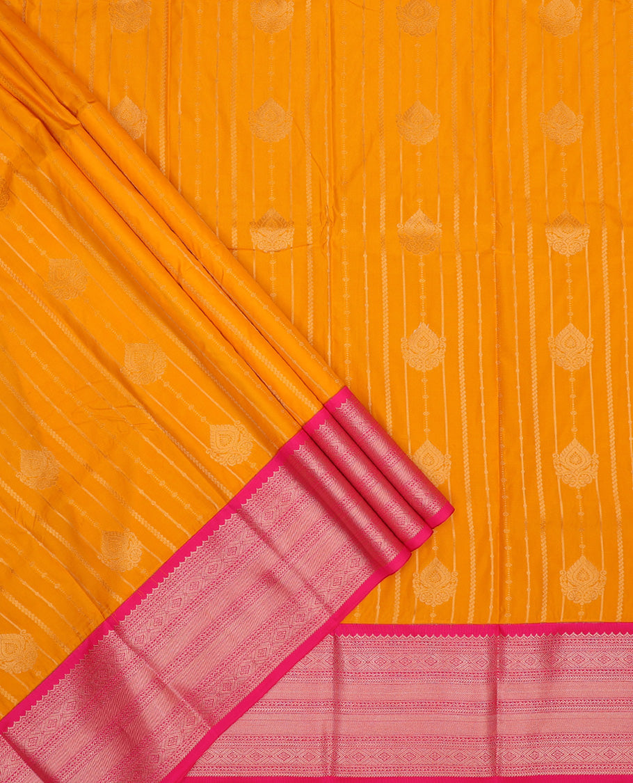 Mango yellow art silk pavadai set, zari design with contrast traditional zari bordered skirt and a contrast zari design blouse