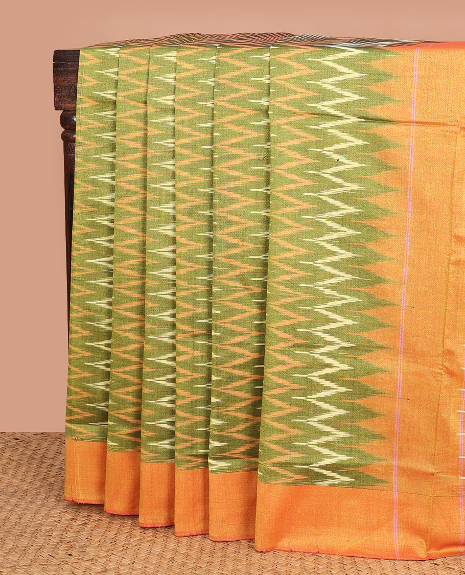 Green chevron striped ikkat cotton saree, contrast plain border, and chevron design pallu