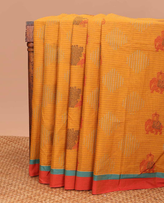 Orange geometric and animal motifs printed Coimbatore cotton saree, contrast border, and pallu of elephant, peacock and leaf motifs