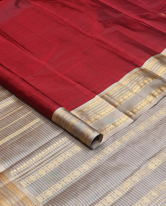Red striped and buttas Kanchipuram silk saree, contrast rettai pettu border of thilakam mokku, muthu, neli, and rudraksham designs and zari design pallu