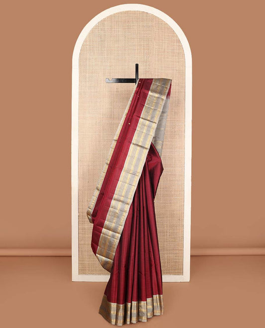Red striped and buttas Kanchipuram silk saree, contrast rettai pettu border of thilakam mokku, muthu, neli, and rudraksham designs and zari design pallu