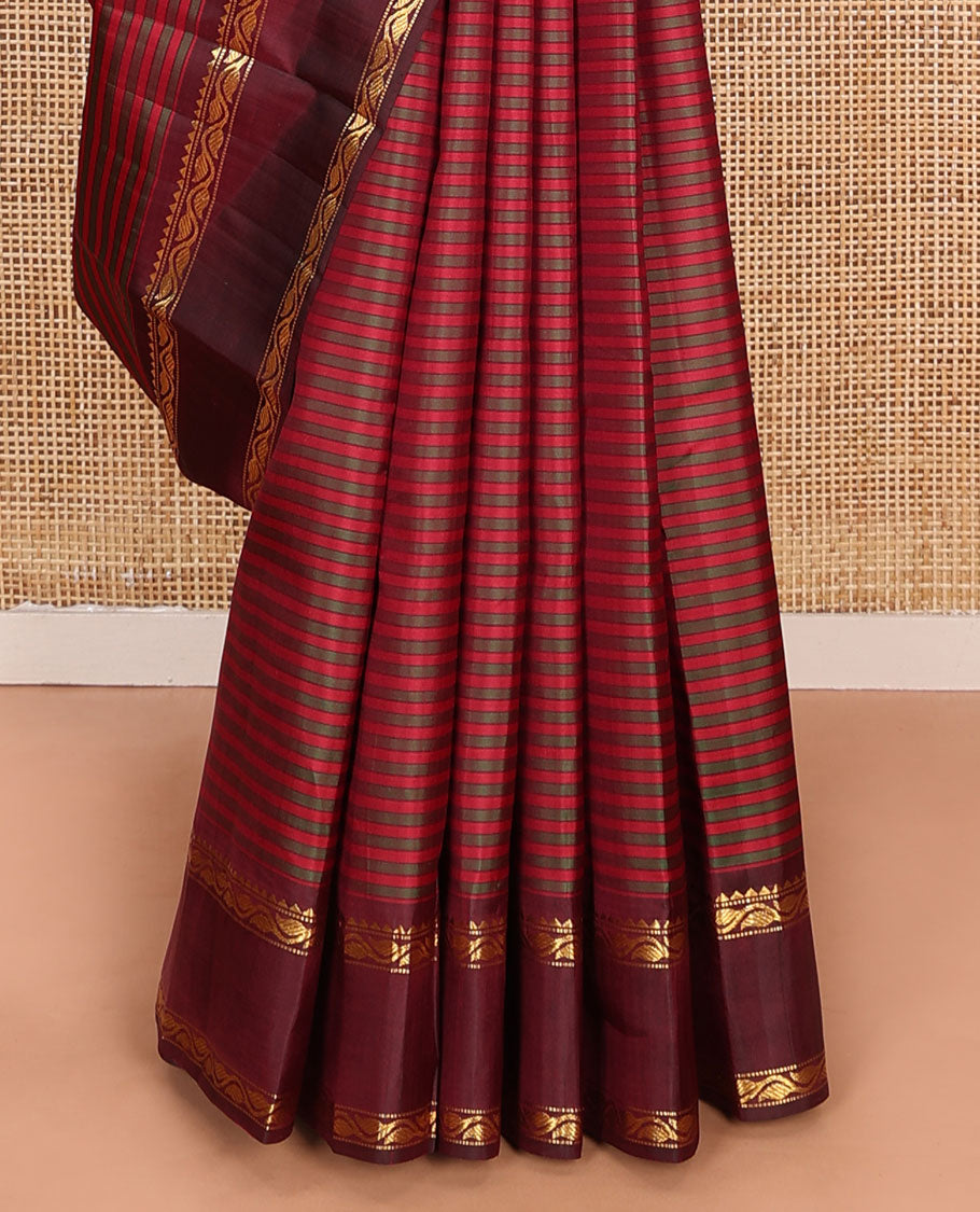 Red striped Kanchipuram silk saree, contrast rettai pettu border of rekku, muthu, and leaf creeper designs, and zari striped pallu