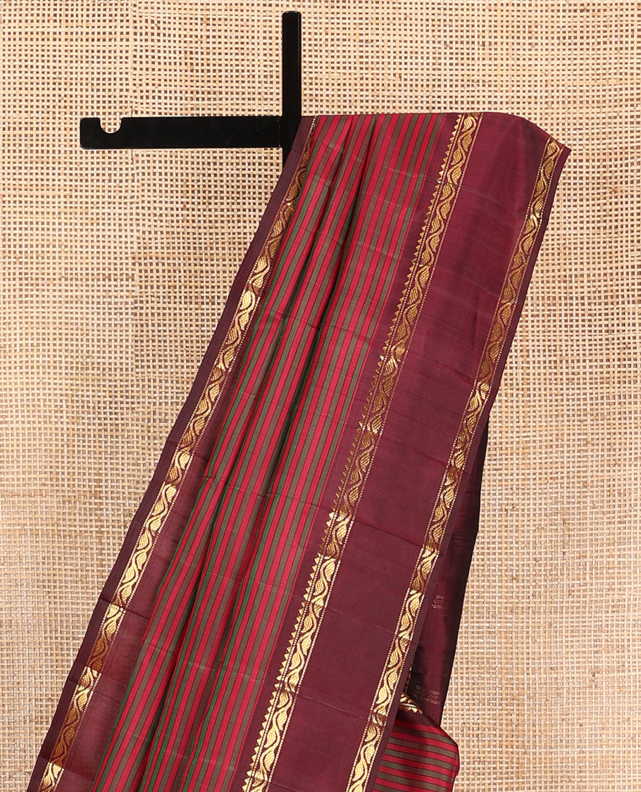 Red striped Kanchipuram silk saree, contrast rettai pettu border of rekku, muthu, and leaf creeper designs, and zari striped pallu