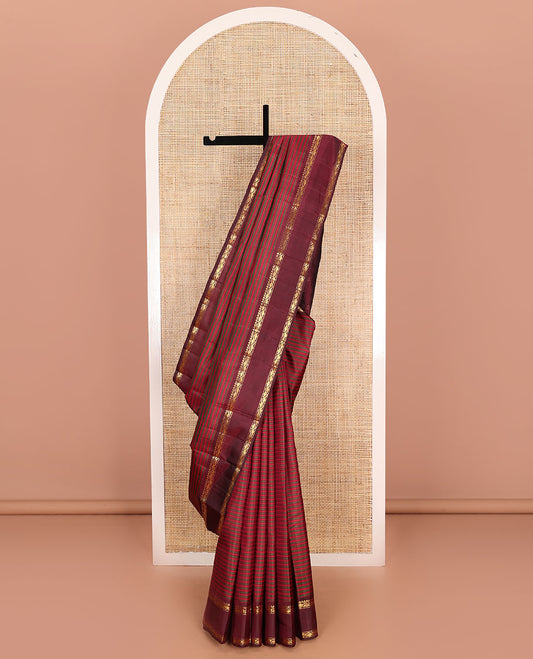Red striped Kanchipuram silk saree, contrast rettai pettu border of rekku, muthu, and leaf creeper designs, and zari striped pallu