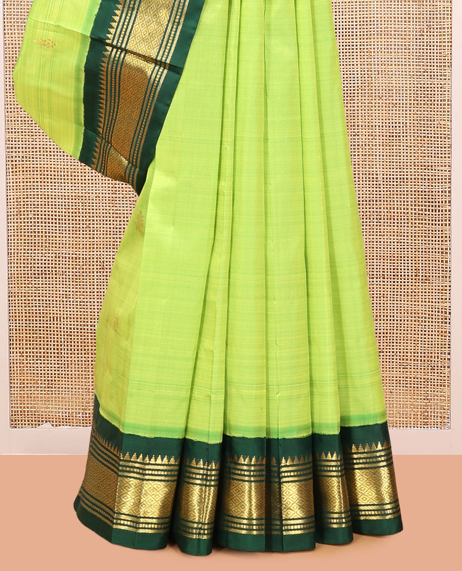 Green Kanchipuram Silk Saree, Subtly Woven with Zari Buttas, Complemented by a Contrast Korvai Border of Rekku, Banaras, Muthu, and Mayil Kann Design, Zari Design Pallu, and No Blouse