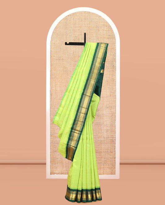 Green Kanchipuram Silk Saree, Subtly Woven with Zari Buttas, Complemented by a Contrast Korvai Border of Rekku, Banaras, Muthu, and Mayil Kann Design, Zari Design Pallu, and No Blouse