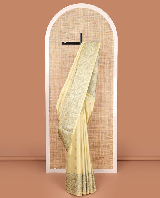 Pastel yellow floral buttas soft silk saree, floral-bird design border, and intricately designed pallu