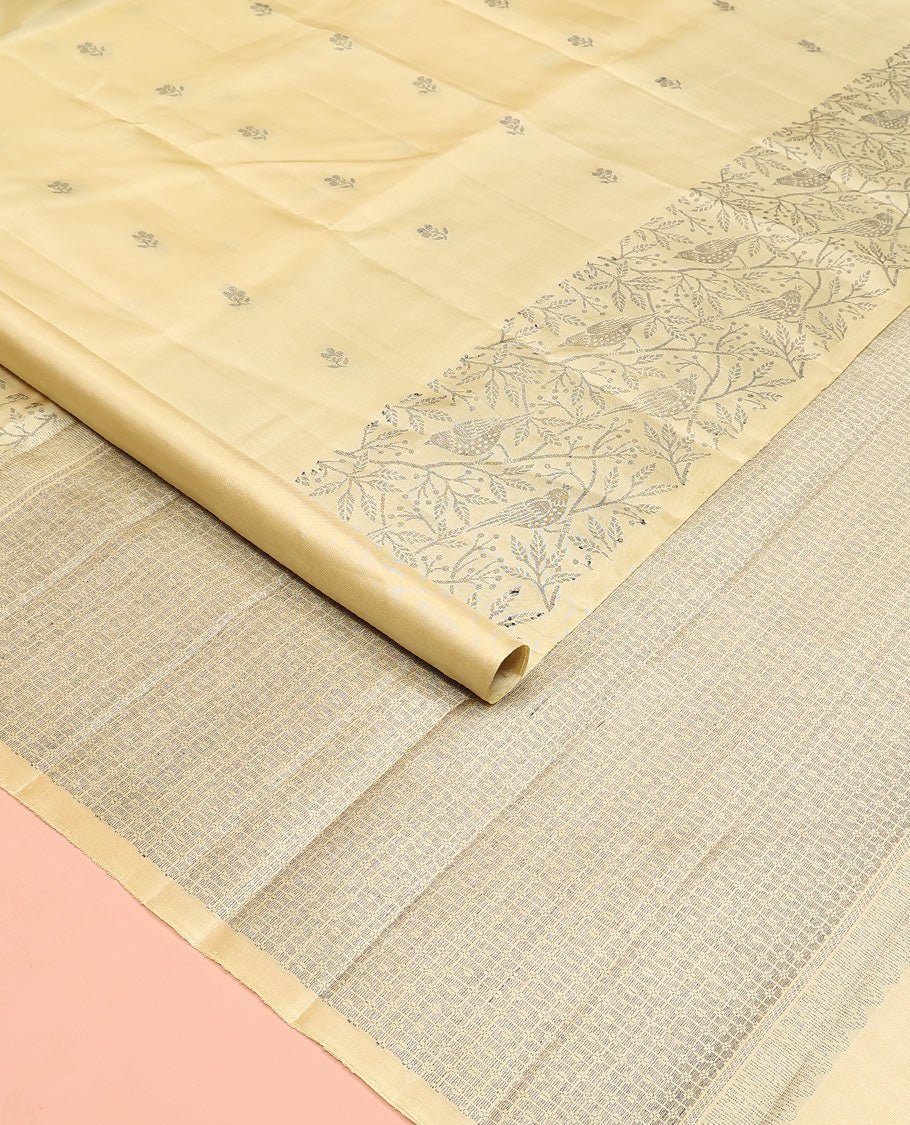 Pastel yellow floral buttas soft silk saree, floral-bird design border, and intricately designed pallu