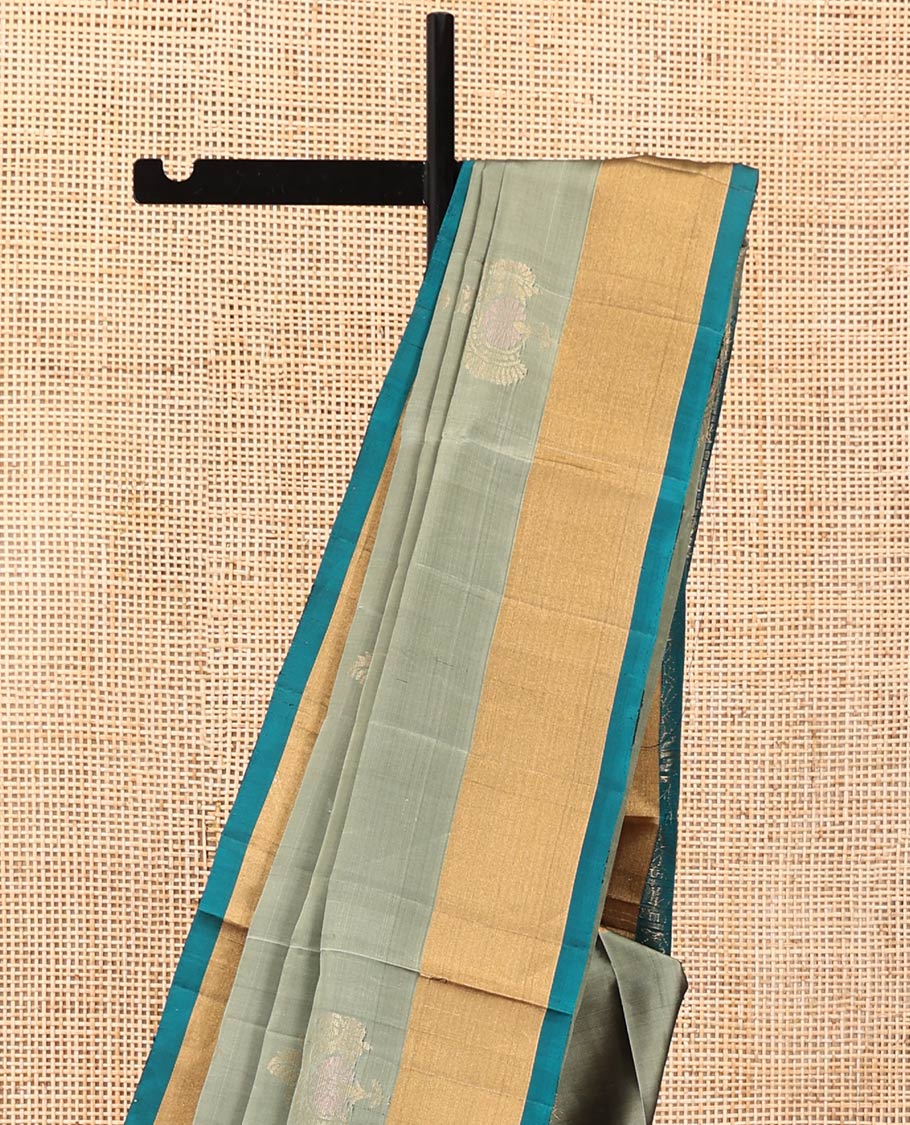 Green Mayuri Lite Silk Mix Saree, Subtly Sparkled with Zari Buttas on Its Body, Complemented by a Contrast Bavanji Border, a Contrast Pallu of Intricate Designs, and Paired with a Contrast Blouse