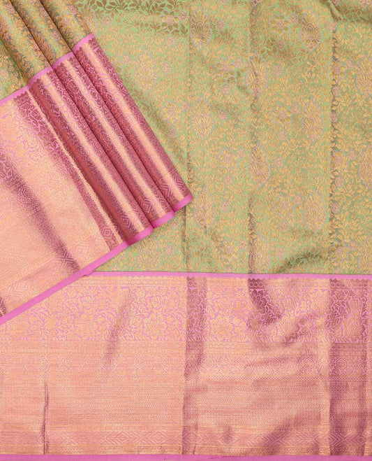 Green pure-silk half saree, jacquard with contrast traditional zari bordered skirt, blouse of rekku, kodi visiry, paisa, diamond, and then kuli kann, and zari design dhavani