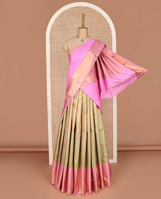 Green pure-silk half saree, jacquard with contrast traditional zari bordered skirt, blouse of rekku, kodi visiry, paisa, diamond, and then kuli kann, and zari design dhavani