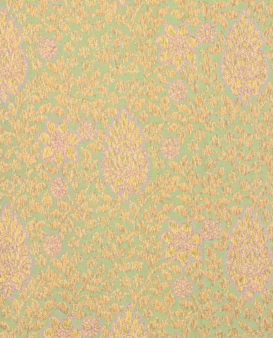 Green pure-silk half saree, jacquard with contrast traditional zari bordered skirt, blouse of rekku, kodi visiry, paisa, diamond, and then kuli kann, and zari design dhavani