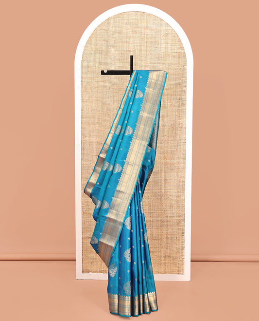 Blue Vasundhara Silk Mix Saree, Detailed with Zari Buttas All Over Its Body, Highlighted by Zari Border of Diamond and Chakram Designs, Grand Vanki Design Pallu, and Paired with a Matching Blouse