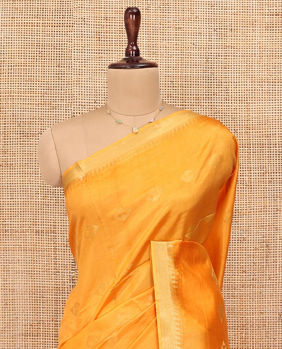 Yellow Banana Pith Saree, Sparsely Sparkled with Buttas All Over Its Body, Highlighted by Temple Zari Border, Pallu Steeped with Stripes, and Paired with a Matching Blouse