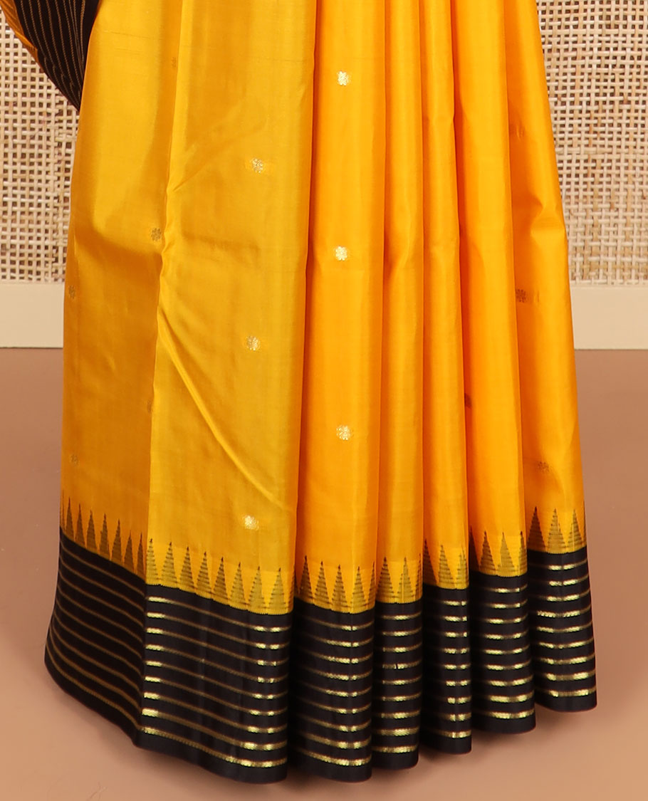 Yellow buttas silk saree with contrast border of rekku, banaras design & striped pallu