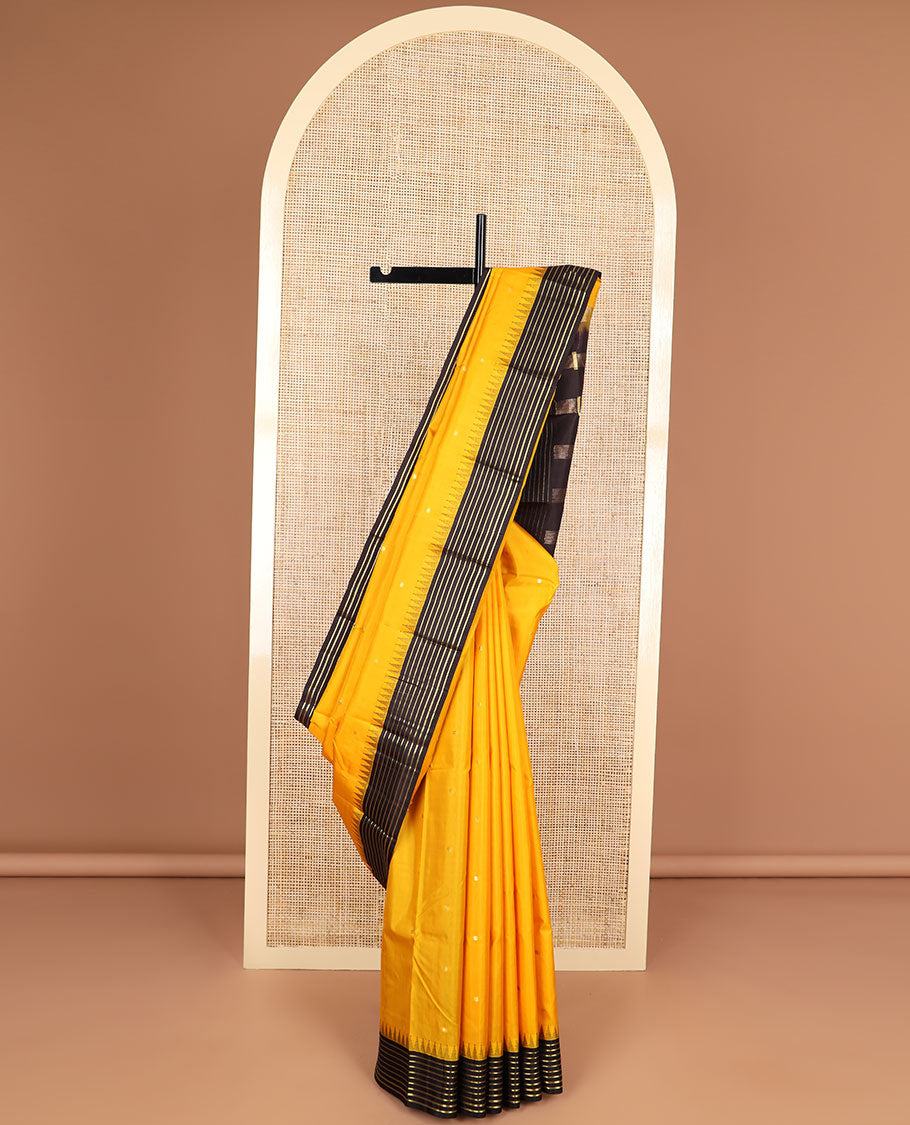 Yellow buttas silk saree with contrast border of rekku, banaras design & striped pallu