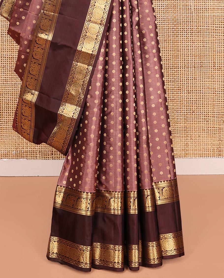 Brown Vasundhara Silk Saree, Beautified with Floral Buttas on Its Body, Complemented by a Contrast Rettai Pettu Border of Rekku, Kathir, Annam Lavangam, and Cross Kamalam Designs, Pallu of Jaal Designs, and Paired with a Contrast Blouse