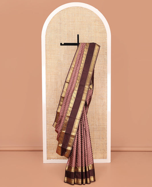 Brown Vasundhara Silk Saree, Beautified with Floral Buttas on Its Body, Complemented by a Contrast Rettai Pettu Border of Rekku, Kathir, Annam Lavangam, and Cross Kamalam Designs, Pallu of Jaal Designs, and Paired with a Contrast Blouse