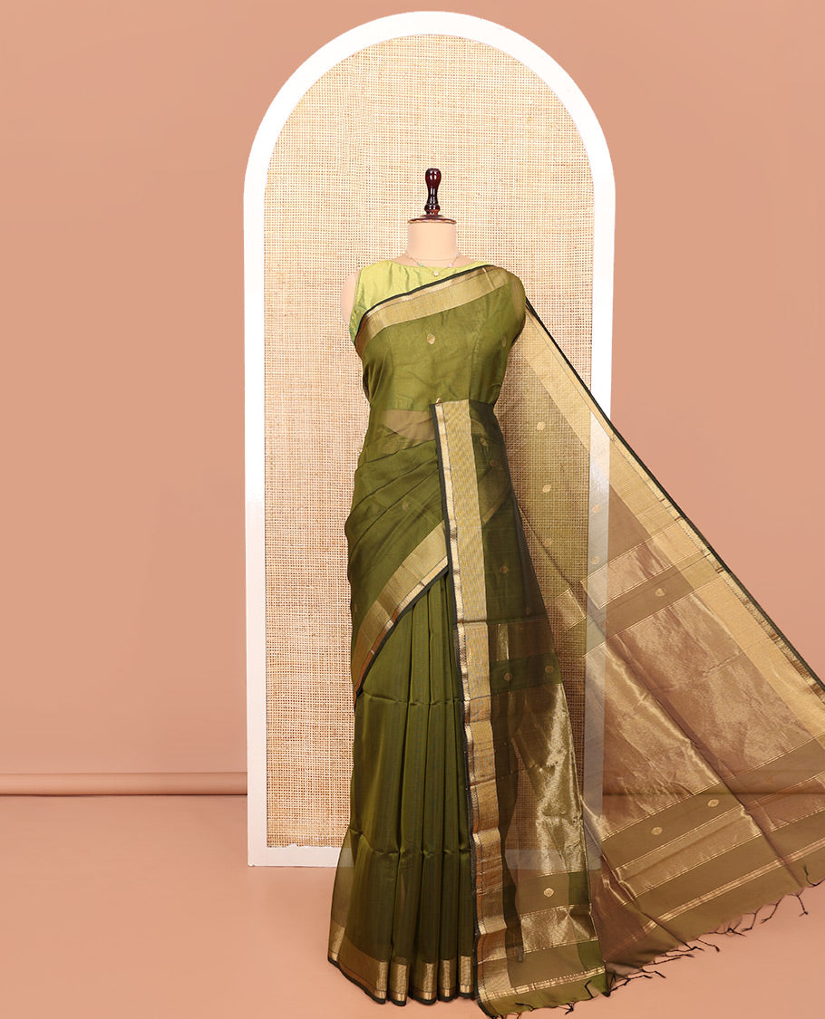 Green Maheshwari Cotton Saree, Beautifully Bedecked with Buttas All Over Its Body, Highlighted by a Zari Traditional Design Border, Pallu Gleamed Up with Zari Stripes, and Paired with a Matching Blouse
