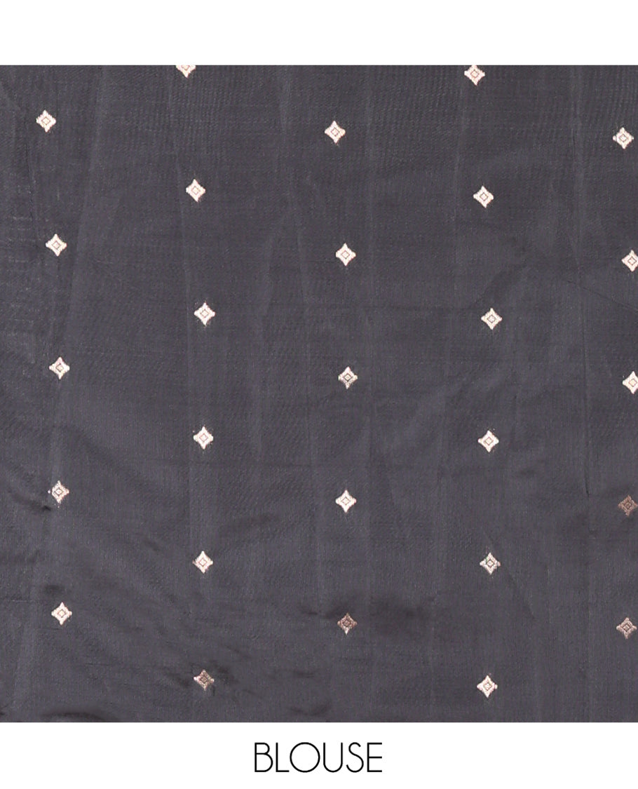 Chikku Kanchi Silk Saree, Adorned with Peacock-Chakram Buttas All Over Its Body, Complemented by a Contrast Border of Floral Creeper Designs, an Intricately Designed Pallu, and Paired with a Matching Blouse