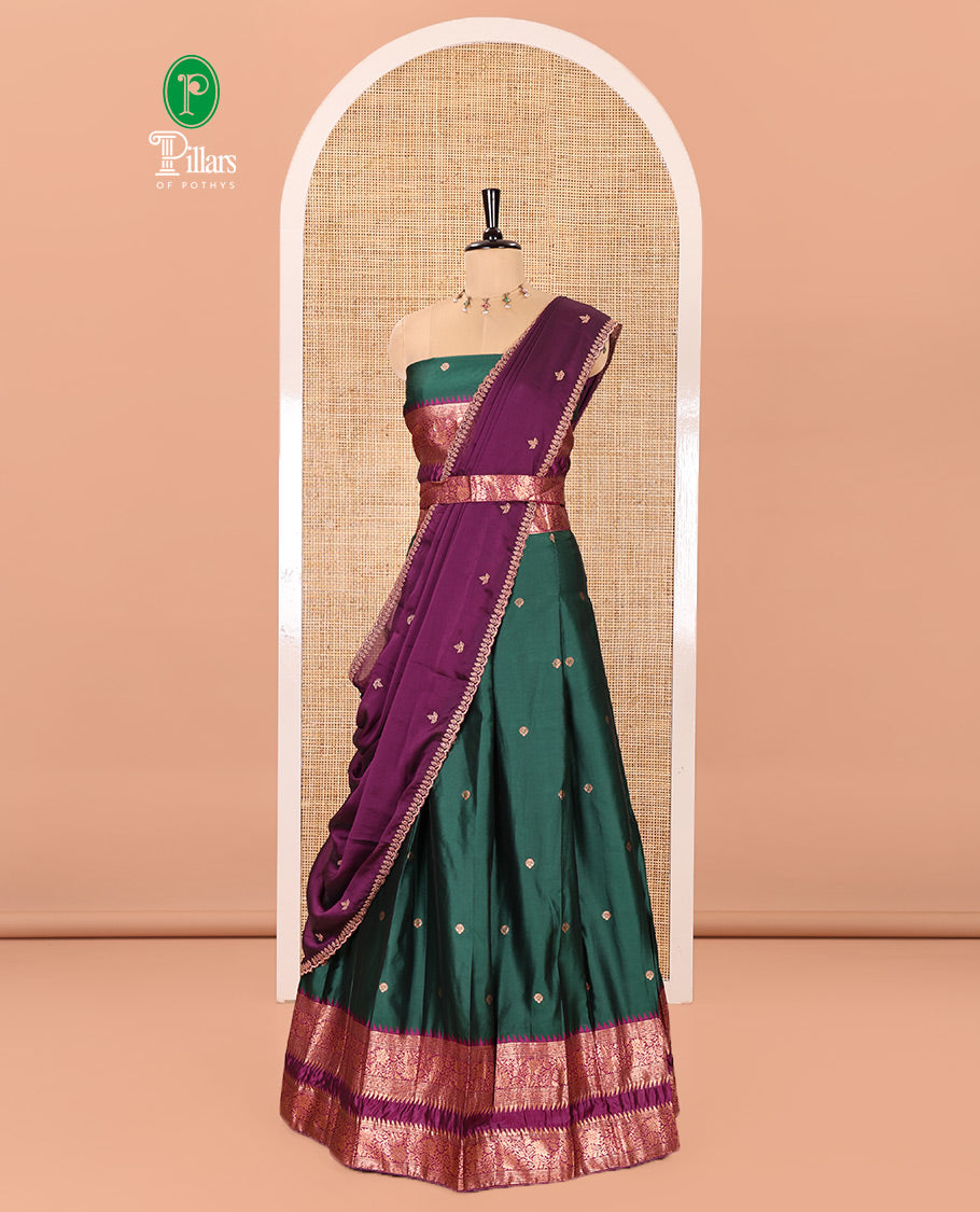 Green-Purple Semi-Banarasi Half-Saree Showcasing Zari Buttas on Its Skirt, Complemented by a Contrast Traditional Zari Temple Rettai Pettu Border, Paired with a Matching Blouse, and a Satin Georgette Embroidered Scallop Dhavani