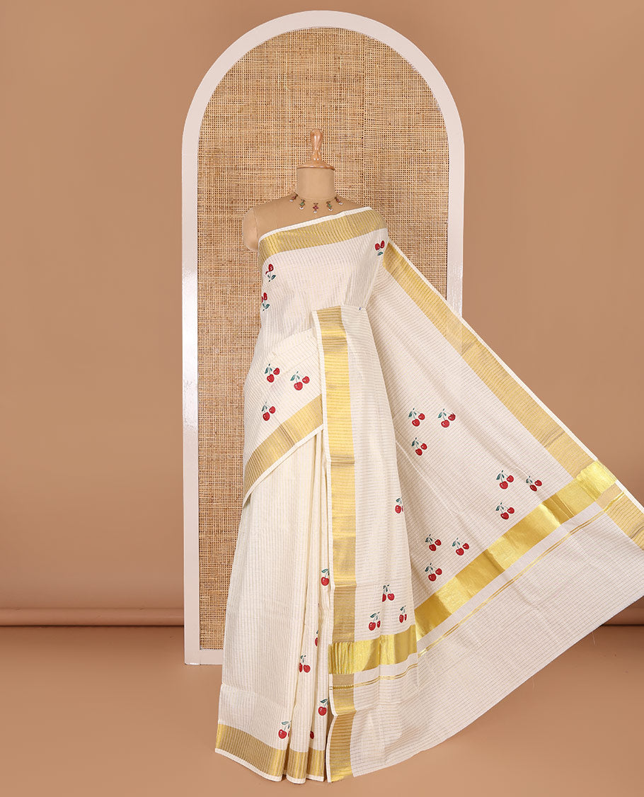 Cream-red vertically striped and cherry fruit motifs printed Kerala cotton saree with zari striped border, printed pallu, and a matching blouse