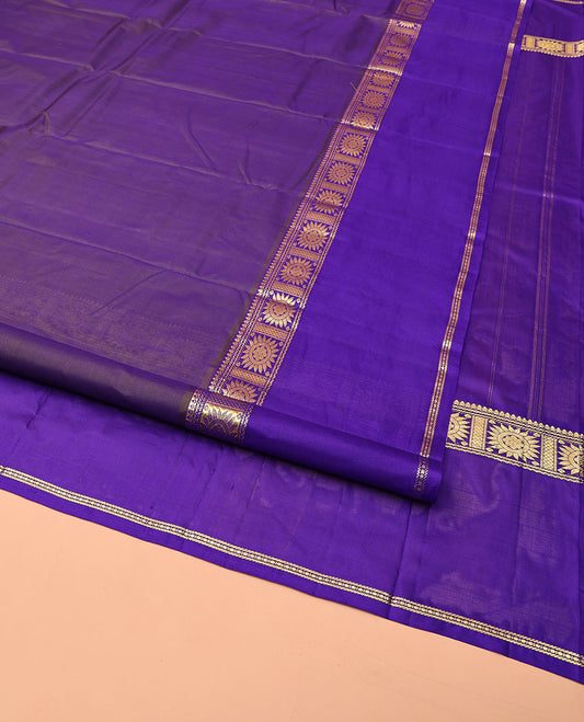 Blue Kanchipuram Silk Saree, Decorated with Zari Buttas All Over Its Body, Complemented by a Contrast Rettai Pettu Border of Chakram Designs, Subtly Striped Pallu, and Paired with a Contrast Blouse