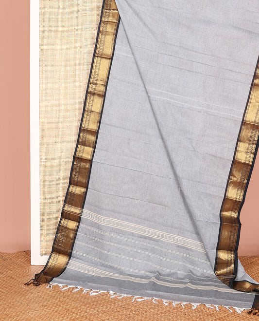 Grey Plain Chettinad Cotton Saree, Complemented by a Contrast Traditional Motifs Woven Zari Border, and Subtly Striped Pallu