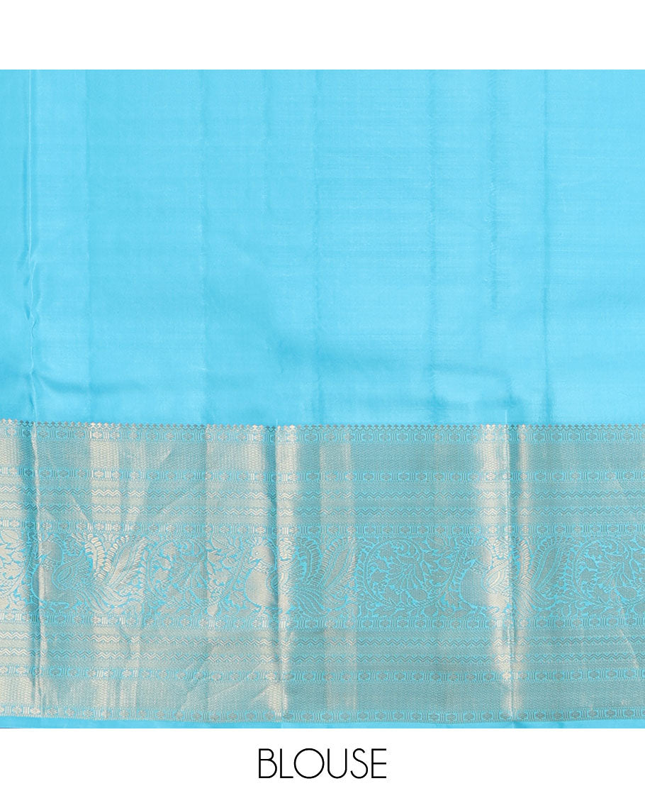 Brown Vasundhara Silk Saree, Elegantly Highlighted with Zari Buttas All Over Its Body, Complemented by Contrast Border of Salngai, Rettai Neli, Kodi Mayil, and Mayil Kann Designs, Grandly Embellished Pallu, and Paired with a Contrast Blouse