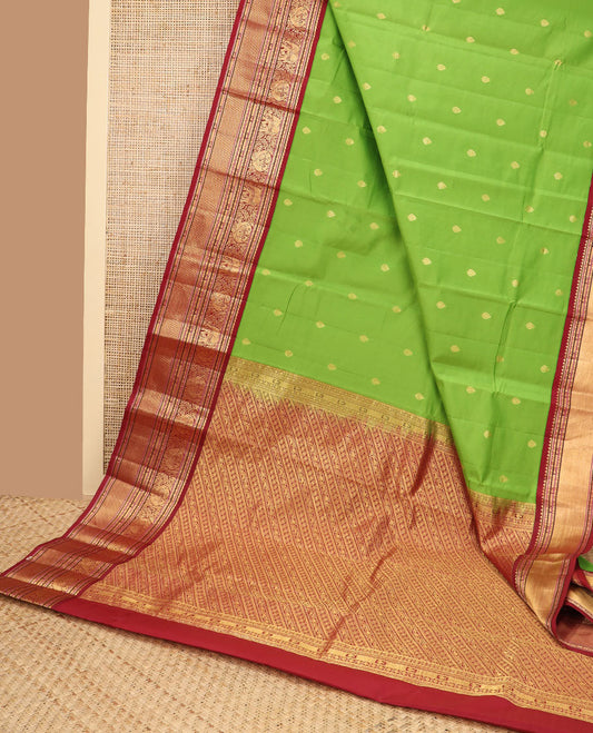 Green floral buttas vasundhara elite silk saree with contrast traditional zari design border & striped floral design pallu