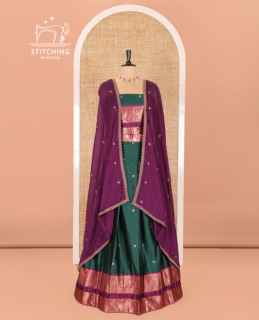 Green-Purple Semi-Banarasi Half-Saree Showcasing Zari Buttas on Its Skirt, Complemented by a Contrast Traditional Zari Temple Rettai Pettu Border, Paired with a Matching Blouse, and a Satin Georgette Embroidered Scallop Dhavani
