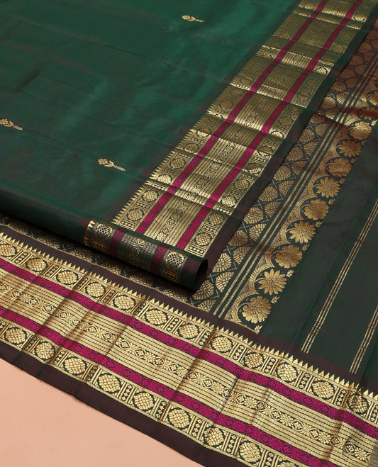 Green Kanchipuram Silk Saree, Mesmerized with Zari Buttas on Its Body, Complemented by a Contrast One-Sided Border of Rekku, Laddu Kamalam, Kathir, and Jada Nagam Designs, Pallu Steeped with Laddu Kamalam Designs, and Comes Without a Blouse