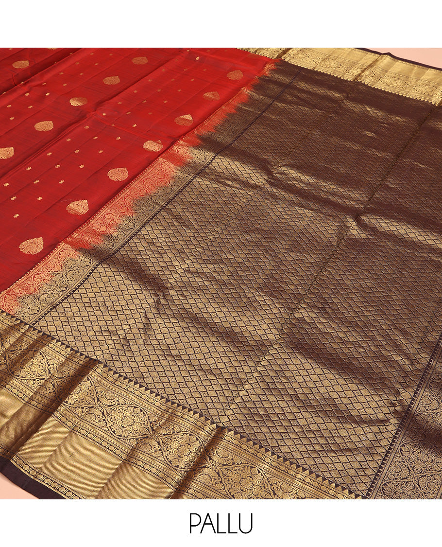 Maroon Vasundhara Silk Saree, Decked Up with Zari Buttas All Over Its Body, Complemented by Contrast Border of Rekku Poun, Muthu, and Floral Designs, Grand Jaal Pallu and Paired with a Contrast Blouse