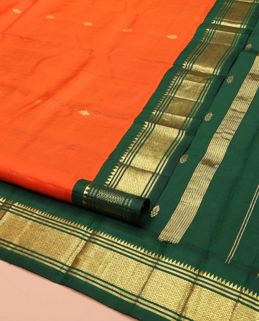 Orange Kanchipuram Silk Saree, Finely Crafted with Zari Buttas on Its Body, Complemented by a Contrast One-Sided Korvai Border of Rekku, Banaras, and Mayil Kann Designs, Pallu of Zari Designs, and Comes Without a Blouse