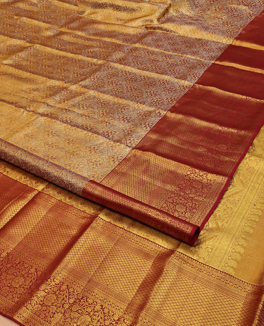 Red Kanchipuram Silk Saree, Richly Detailed with Jacquard Design All Over Its Body, Highlighted by a Zari Border of Thilakam Mokku, Kodi Visiry, Ara Maadam, Jaal, and Floral Designs, and Pallu of Jaal Designs, and Paired with a Matching Blouse