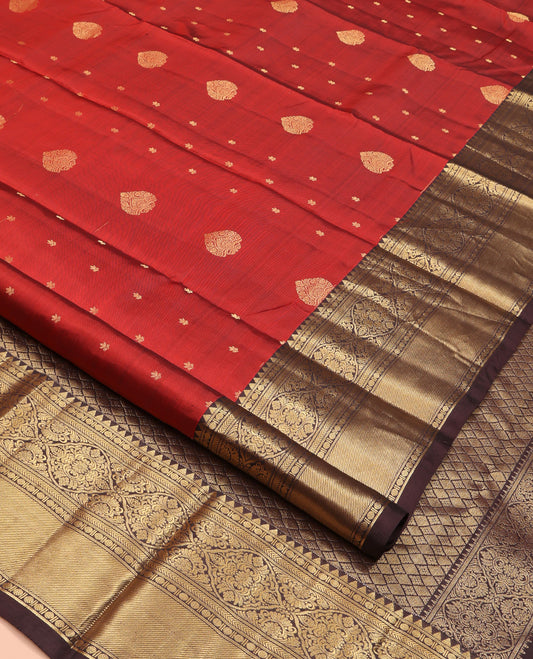 Orange Vasundhara Silk Saree, Decked Up with Zari Buttas All Over Its Body, Complemented by Contrast Border of Rekku Poun, Muthu, and Floral Designs, Grand Jaal Pallu and Paired with a Contrast Blouse