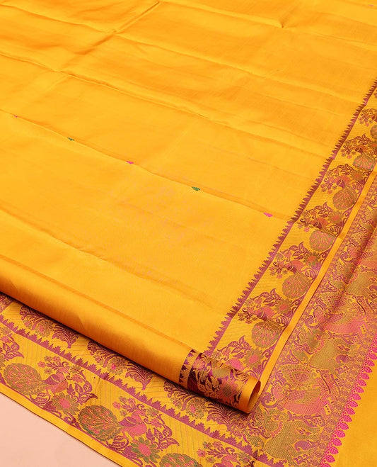 Yellow Kanchipuram Silk Saree, Delicately Woven with Thread Buttas All Over Its Body, Highlighted by a Self-Border of Thazampoo Rekku, and Mayil Designs, Pallu Steeped with Floral Designs, and Paired with a Matching Blouse