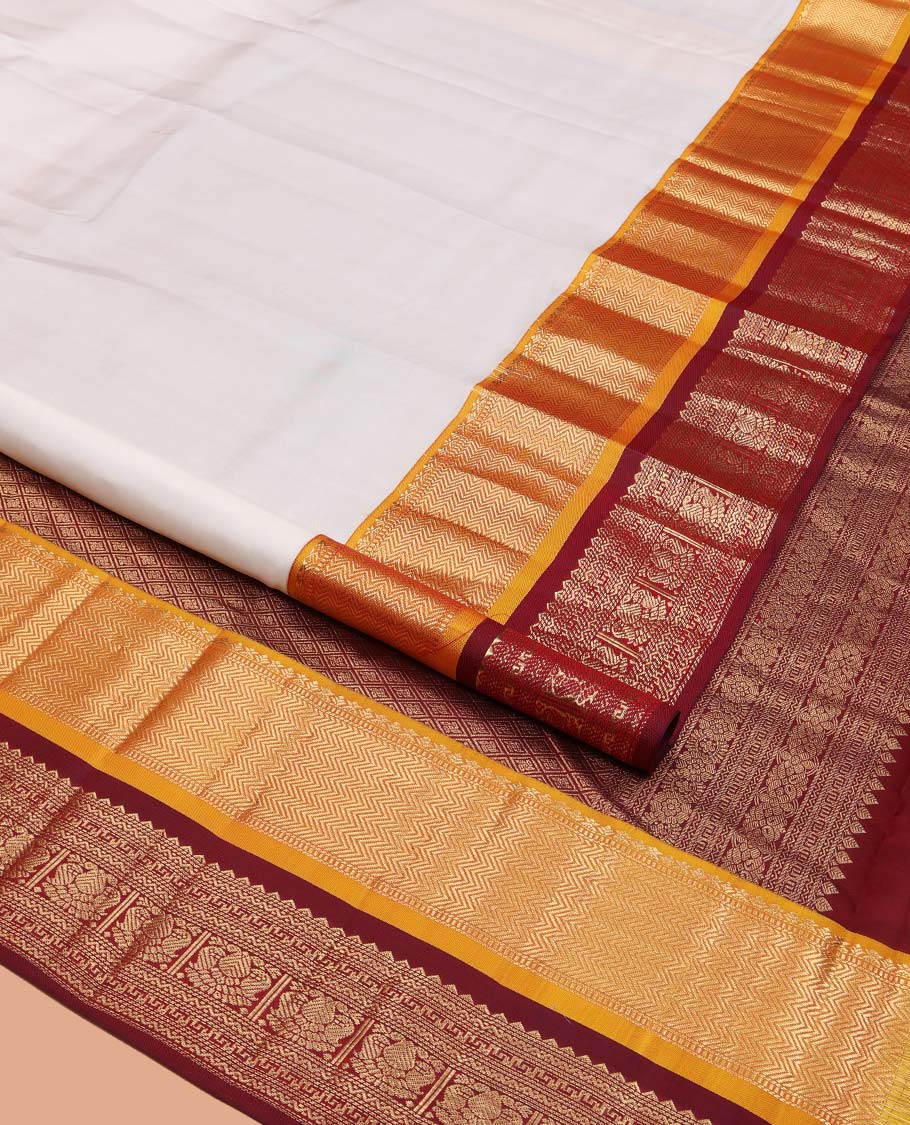White Plain Vasundhara Silk Saree, Complemented by a Contrast Border of Muthu, Vanki, Rekku, Neli, Greek Key, and Iruthalai Pakshi Designs, Grand Jaal Pallu, and Paired with a Contrast Blouse