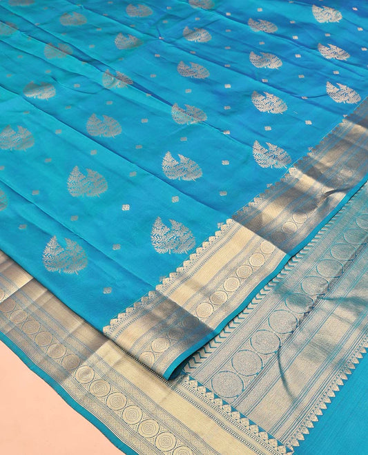 Blue Vasundhara Silk Mix Saree, Detailed with Zari Buttas All Over Its Body, Highlighted by Zari Border of Diamond and Chakram Designs, Grand Vanki Design Pallu, and Paired with a Matching Blouse