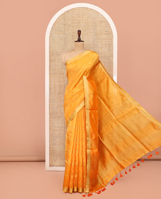 Yellow Banana Pith Saree, Sparsely Sparkled with Buttas All Over Its Body, Highlighted by Temple Zari Border, Pallu Steeped with Stripes, and Paired with a Matching Blouse