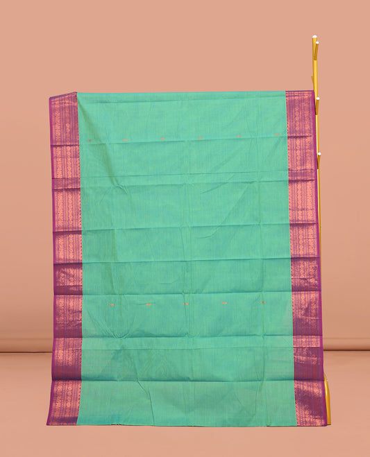 Green Chettinad Cotton Saree, Subtly Sparkled with Buttas All Over Its Body, Complemented by a Contrast Traditional Zari Design Border, Pallu of Stripes, and Paired with a Matching Blouse