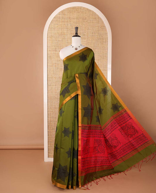 Olive green six-petal-like leaf motifs printed micro-silk saree, copper zari border, contrast intricate pallu & plain red blouse