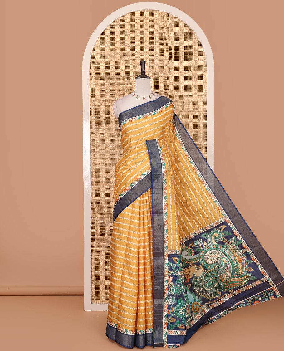 Mustard shibori-style printed soft-tussar saree, contrast zari border, kalamkari peacock printed pallu & kalamkari floral vine print contrast blouse