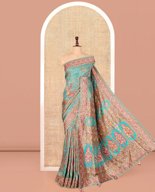 Blue Dola Silk Saree, Beautifully Bedecked with Colorful Floral-Paisley Design on Its Body, Complemented by Contrast Paisley Border, Pallu of Mughal-Style Design, and Paired with a Matching Blouse